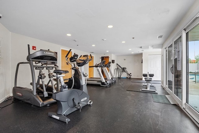gym with recessed lighting and baseboards