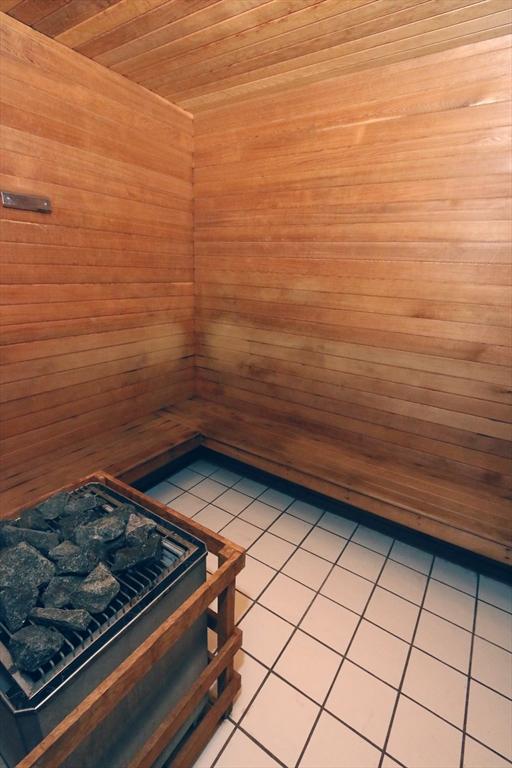 sauna with tile patterned flooring