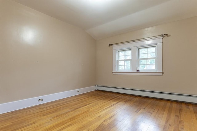 18 Balder Rd, Worcester, MA 01605 - empty room with baseboard heating, lofted ceiling, and light wood finished floors