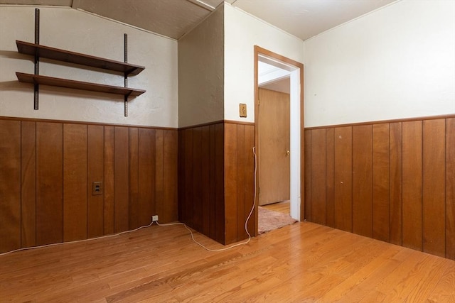 18 Balder Rd, Worcester, MA 01605 - spare room featuring light wood-style flooring, wooden walls, and wainscoting
