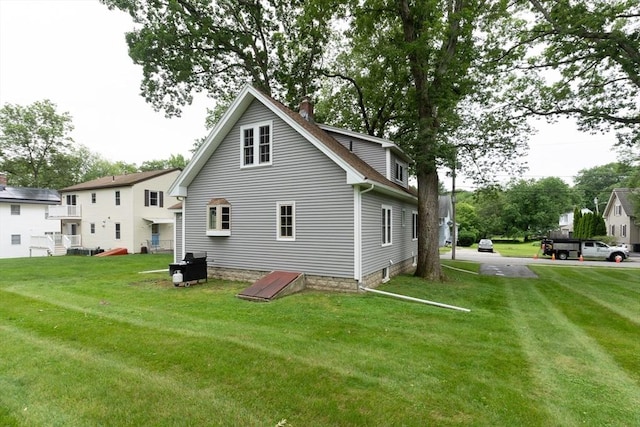 18 Balder Rd, Worcester, MA 01605 - rear view of house featuring a chimney and a lawn