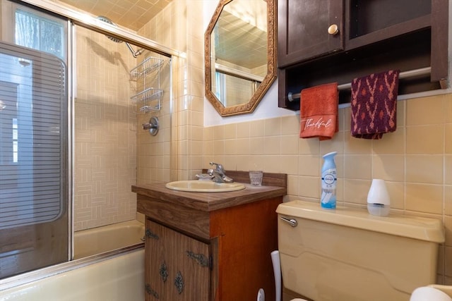 18 Balder Rd, Worcester, MA 01605 - bathroom featuring tile walls, bath / shower combo with glass door, and vanity
