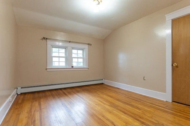18 Balder Rd, Worcester, MA 01605 - unfurnished room featuring a baseboard radiator, light wood finished floors, and vaulted ceiling