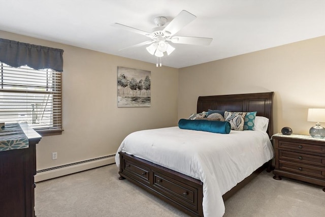 bedroom with baseboard heating, light colored carpet, and ceiling fan