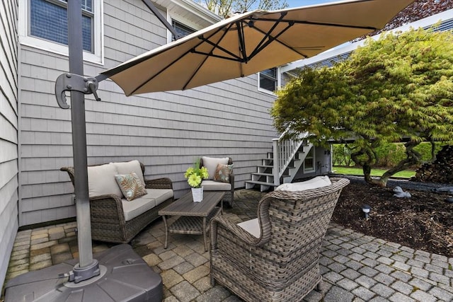 view of patio featuring stairway and outdoor lounge area