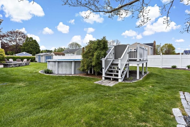 view of yard with a wooden deck