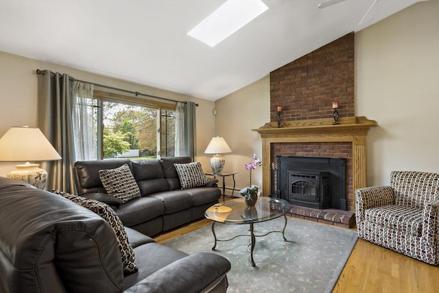 living area with lofted ceiling, wood finished floors, a fireplace, and baseboard heating