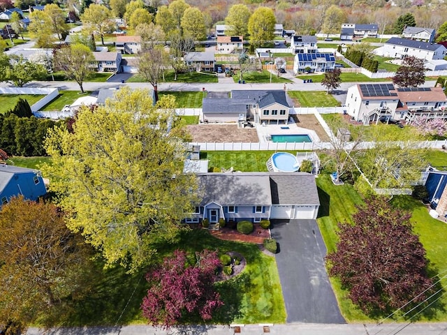 aerial view of residential area featuring a pool