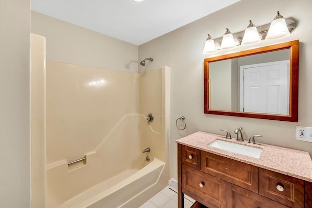 bathroom featuring tile patterned flooring, washtub / shower combination, and vanity