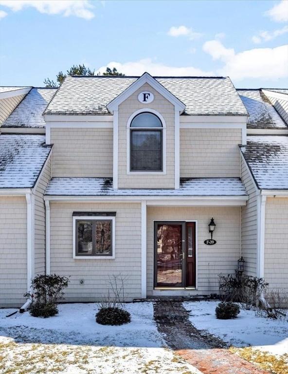 view of front of home with a shingled roof