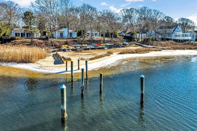 dock area featuring a residential view and a water view