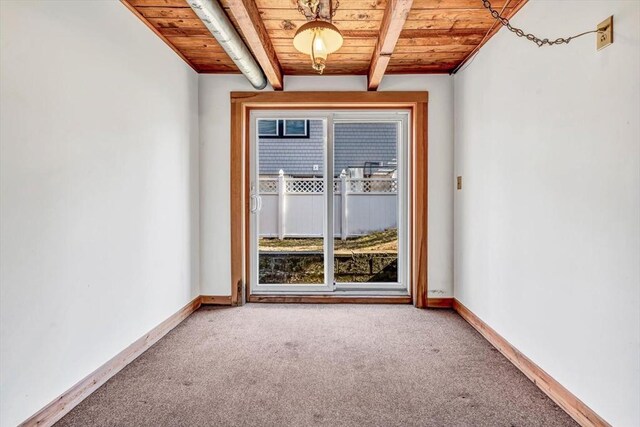 unfurnished room with carpet, beamed ceiling, wooden ceiling, and baseboards