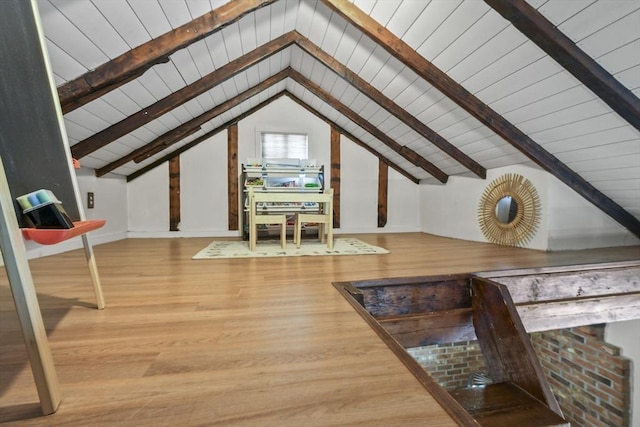 additional living space featuring wood ceiling, vaulted ceiling with beams, wood finished floors, and baseboards