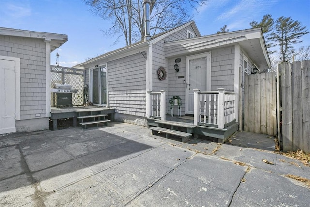 exterior space with a patio area and fence