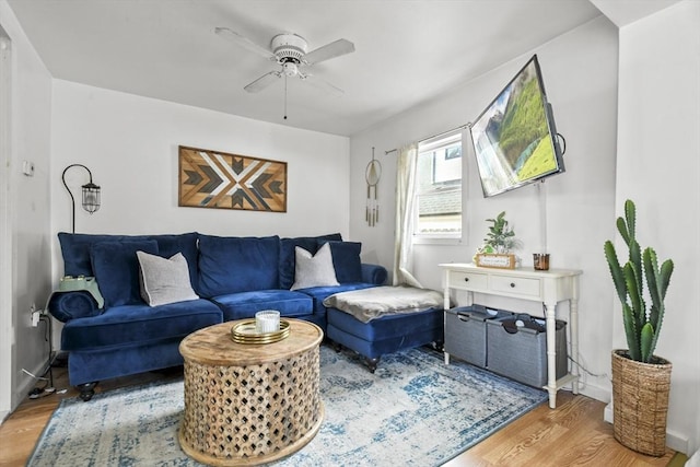 living room with light wood-style floors and ceiling fan