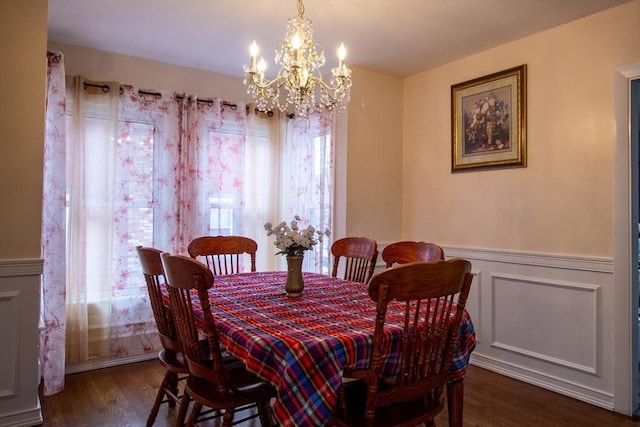 dining room featuring dark wood-type flooring and a notable chandelier