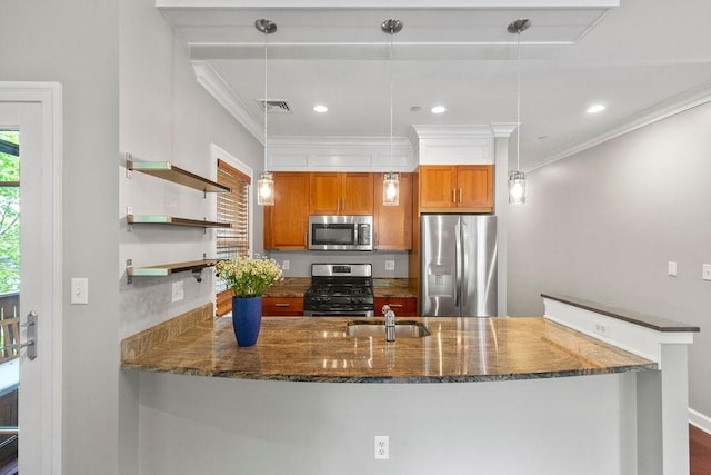121 Green St Unit 304, Boston, MA 02130 - kitchen featuring stainless steel appliances, brown cabinets, dark stone countertops, a peninsula, and crown molding
