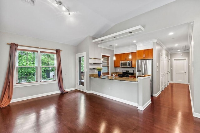 121 Green St Unit 304, Boston, MA 02130 - kitchen featuring stainless steel appliances, brown cabinetry, dark wood finished floors, a peninsula, and hanging light fixtures
