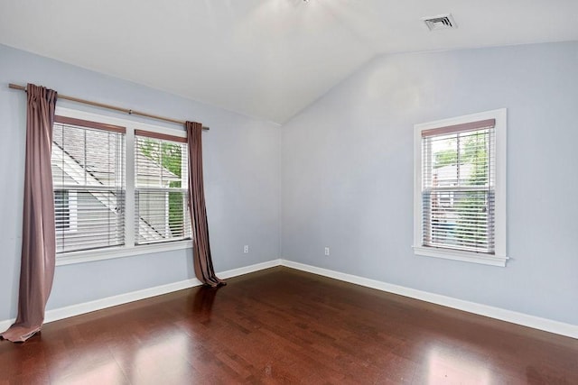 121 Green St Unit 304, Boston, MA 02130 - spare room featuring dark wood-style flooring, lofted ceiling, and healthy amount of natural light