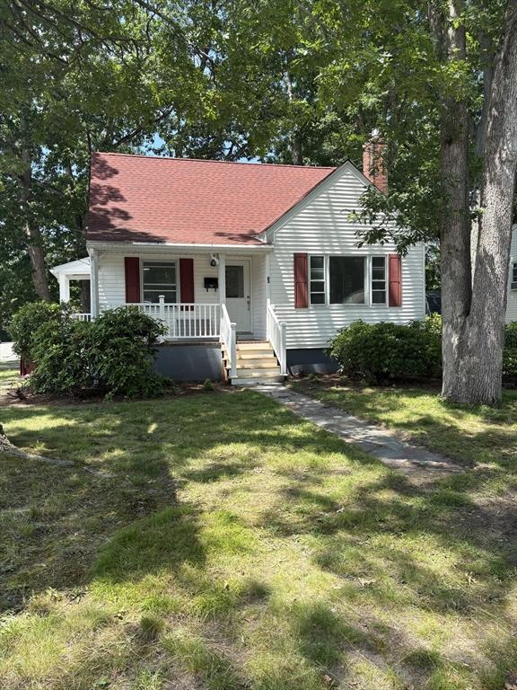 63 Bernice Ave, Brockton, MA 02301 - view of front of property with covered porch, a chimney, a front yard, and roof with shingles