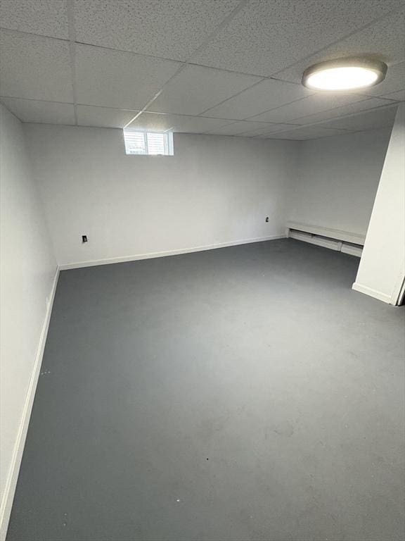 63 Bernice Ave, Brockton, MA 02301 - below grade area featuring a baseboard heating unit and a paneled ceiling