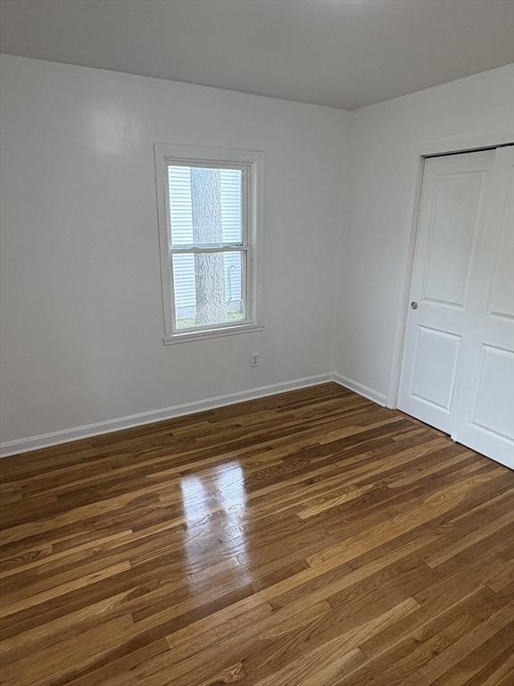63 Bernice Ave, Brockton, MA 02301 - unfurnished bedroom with dark wood-type flooring and a closet