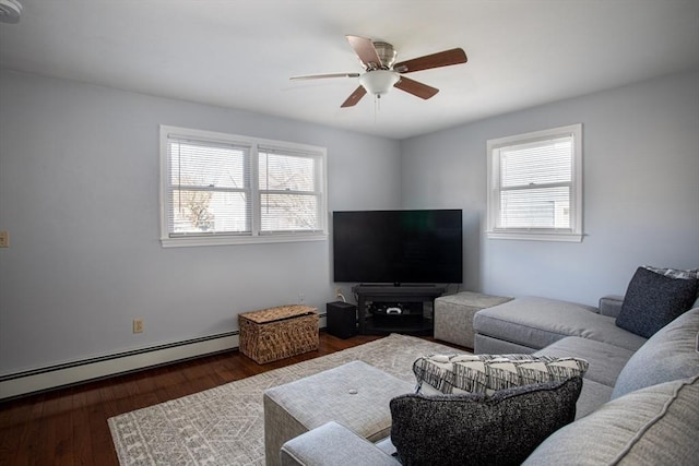 living area with dark wood-style floors, a baseboard radiator, and ceiling fan