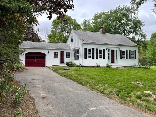1 Pine Island Rd, Newbury, MA 01951 - view of front of property with a garage, entry steps, a chimney, driveway, and a front yard