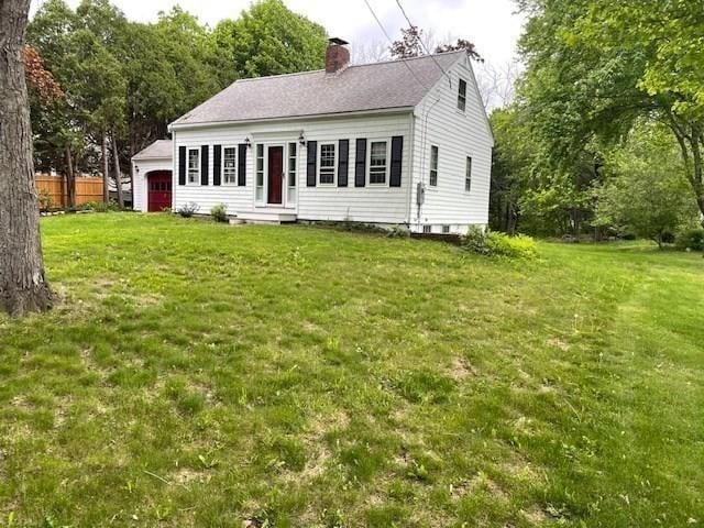 1 Pine Island Rd, Newbury, MA 01951 - view of front facade with a chimney and an attached garage