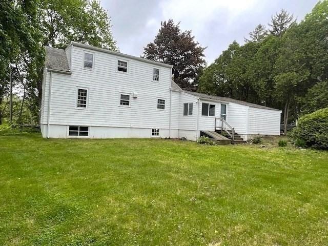 1 Pine Island Rd, Newbury, MA 01951 - back of house with a yard, view of scattered trees, and entry steps