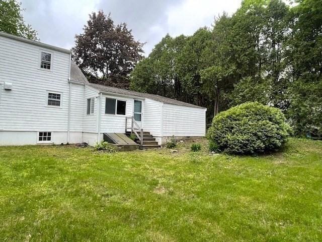 1 Pine Island Rd, Newbury, MA 01951 - back of property with a yard, entry steps, and view of scattered trees