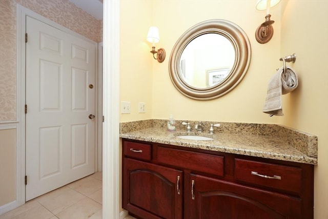 bathroom with tile patterned flooring and vanity