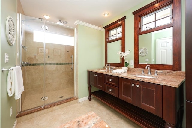 full bath with tile patterned flooring, a stall shower, a wealth of natural light, and a sink