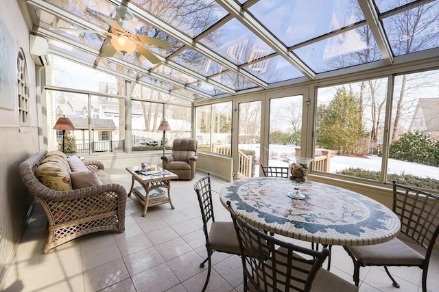 sunroom featuring a ceiling fan