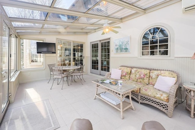 sunroom featuring beam ceiling, an AC wall unit, and ceiling fan