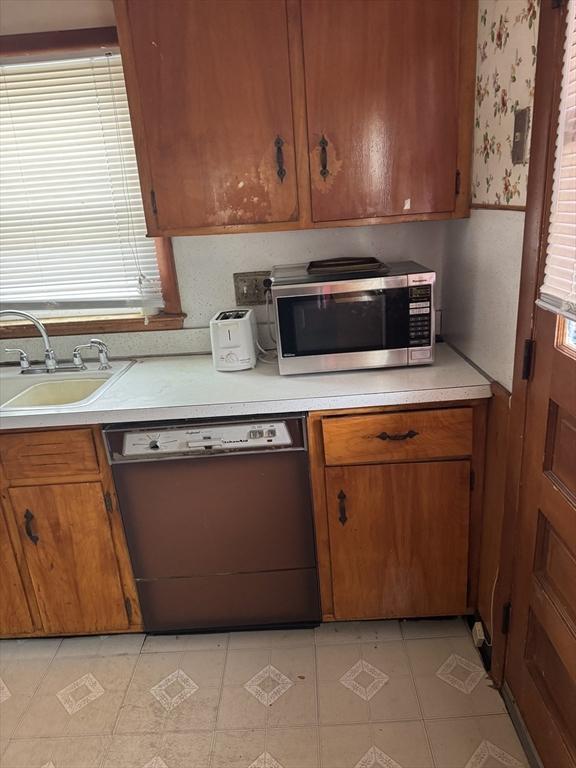 kitchen with black dishwasher and sink