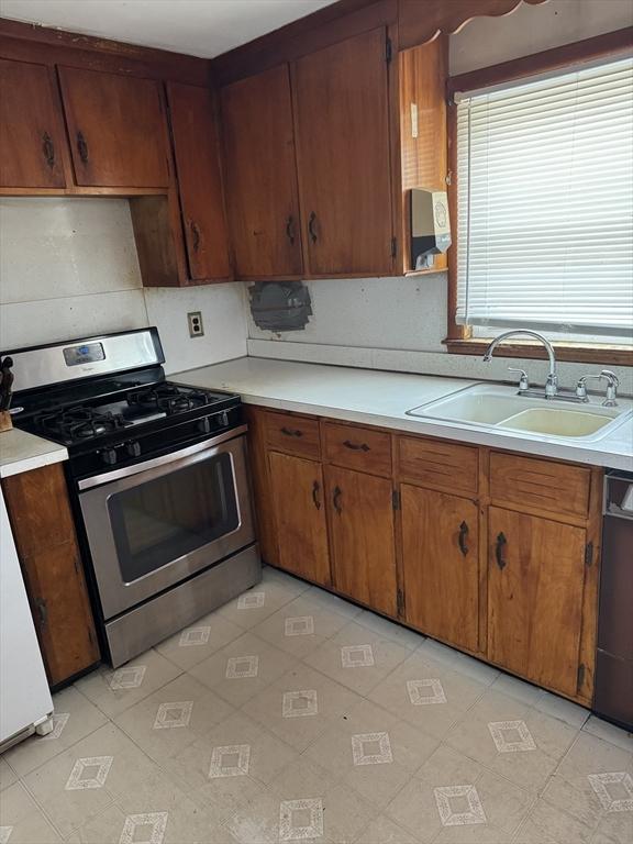 kitchen with appliances with stainless steel finishes and sink