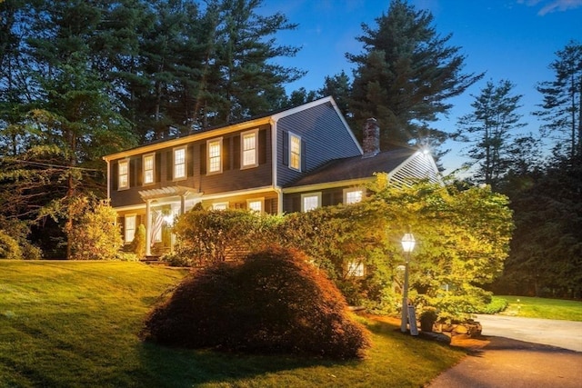 141 Morse Rd, Sudbury, MA 01776 - colonial home featuring a front yard and a chimney
