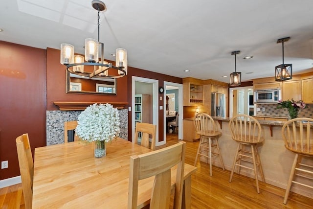 141 Morse Rd, Sudbury, MA 01776 - dining area with a chandelier, light wood-type flooring, and recessed lighting