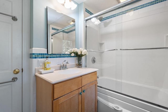 141 Morse Rd, Sudbury, MA 01776 - full bath with enclosed tub / shower combo, vanity, and decorative backsplash