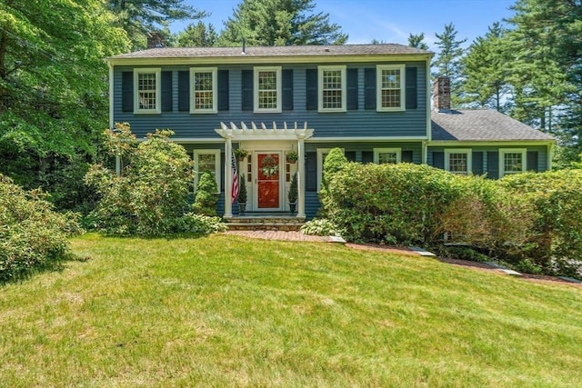 141 Morse Rd, Sudbury, MA 01776 - view of front of house featuring a chimney, a front yard, and a pergola