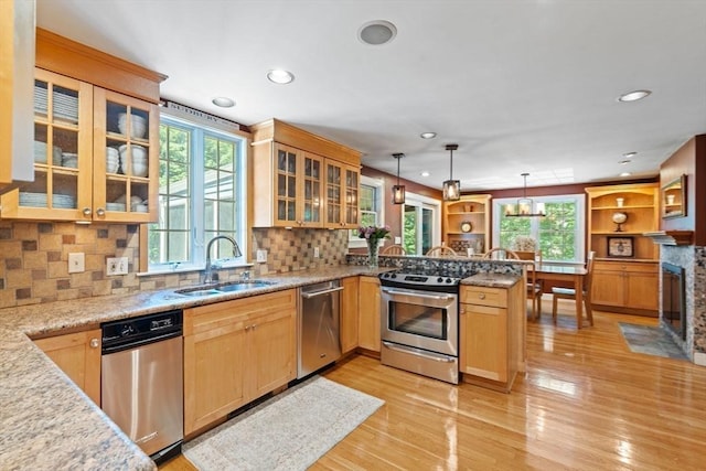 141 Morse Rd, Sudbury, MA 01776 - kitchen featuring stainless steel appliances, a peninsula, healthy amount of natural light, light wood finished floors, and recessed lighting