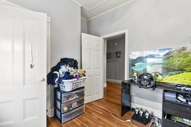 interior space featuring ornamental molding and wood-type flooring