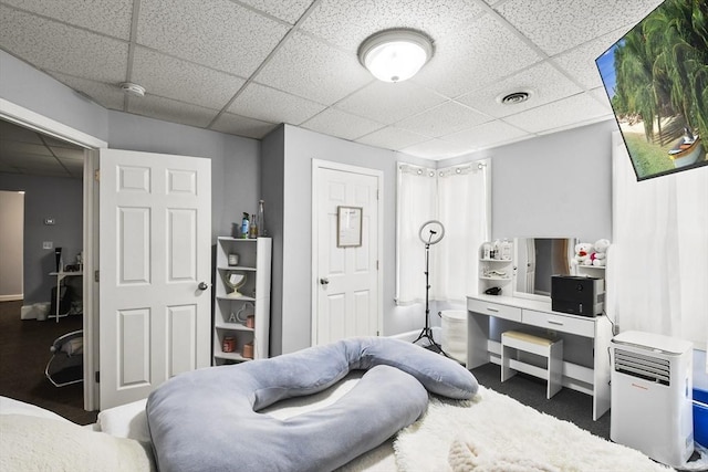 bedroom featuring a drop ceiling