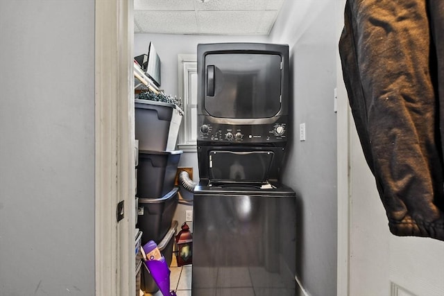 laundry room with stacked washer / drying machine