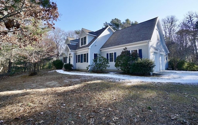 view of side of home featuring a garage