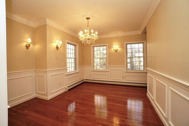 spare room featuring baseboard heating, an inviting chandelier, crown molding, and dark hardwood / wood-style floors