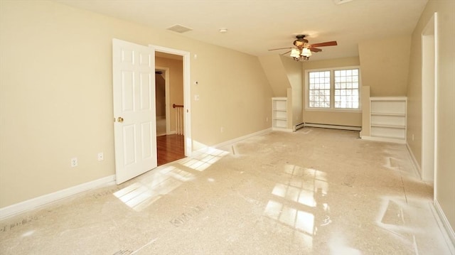 bonus room featuring ceiling fan and a baseboard heating unit