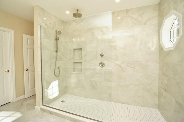 bathroom with tiled shower