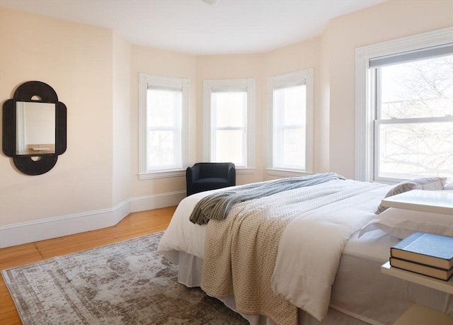 bedroom with light wood-type flooring